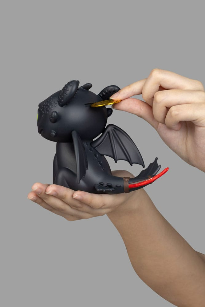 Salvadanaio Sdentato Dragon Trainer poggiato sulla mano di una persona 